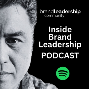 Podcast cover image for 'Inside Brand Leadership' featuring a black and white close-up of a man's face on the left side. The right side includes the text 'brandleadership.community' at the top, 'Inside Brand Leadership PODCAST' in the center, and a green Spotify logo at the bottom.